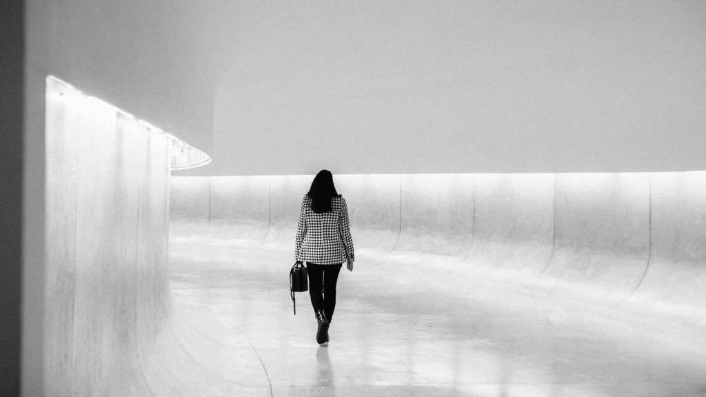 woman walking alone in the hall way florida epoxy flooring